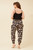 Our gorgeous Eden Harem Pants are perfect for lounging around, doing yoga or just going about your day to day activities in. They're stylish, lightweight and comfortable and the side pokets make them practical! These pants will be on high rotation in you wardrobe for most of the year!

These pants feature:

High, shirred waist
Side pockets with non functional tie details
Shirred cuffs at the ankle
Flowy 
Colour: Black with Beige Geometric Print

Fabric: 100% Viscose

Size Guide: True to size