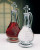 Glass Wine and Water Cruet Set Hand Blown shown here with wine in the grape etched cruet and water in the wave etched cruet