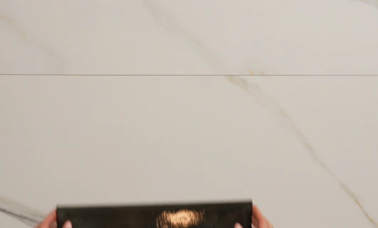KraftMaid cabinetry detail on a marble countertop
