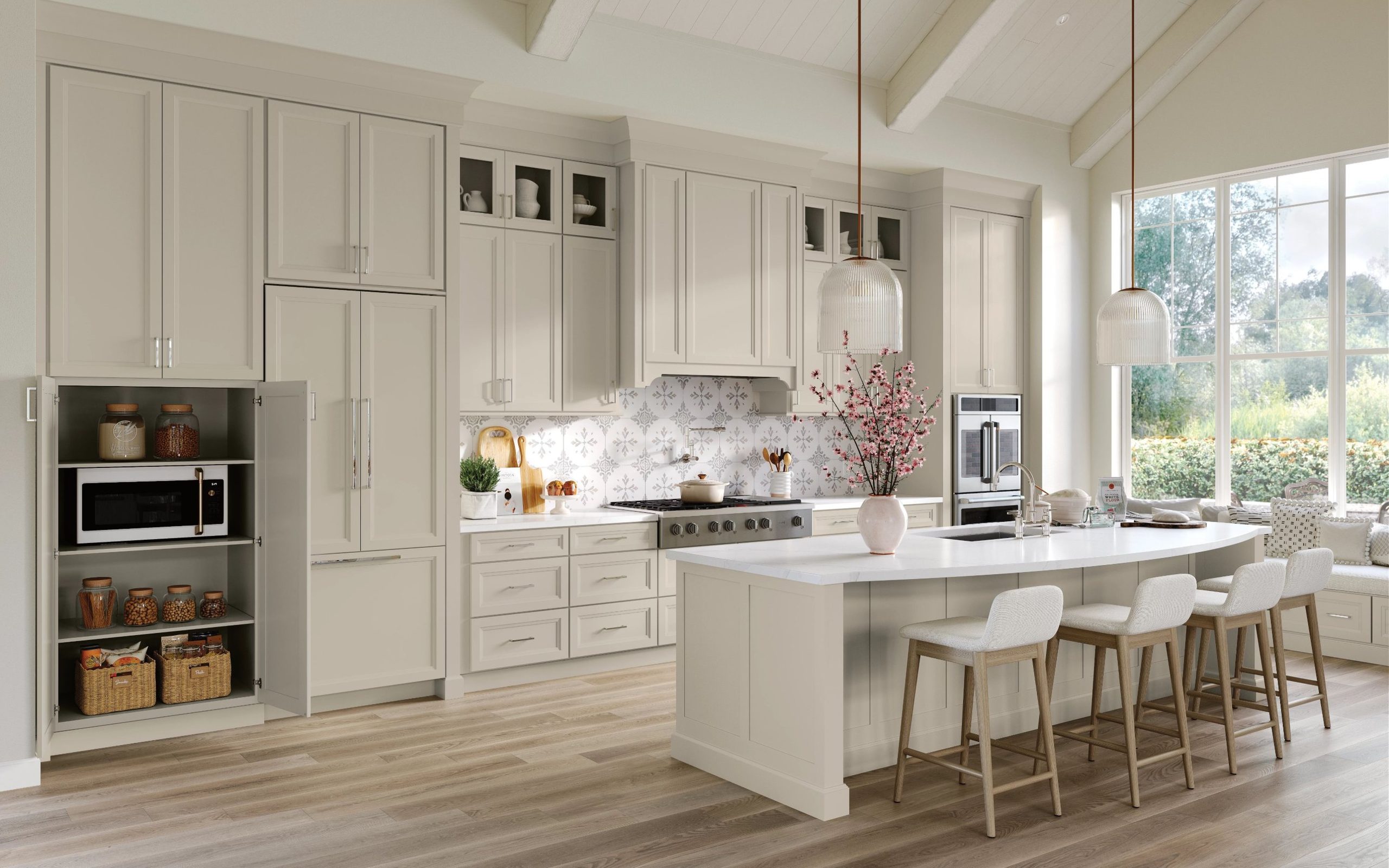 Two-tone kitchen with light perimeter cabinets and a dark charcoal island