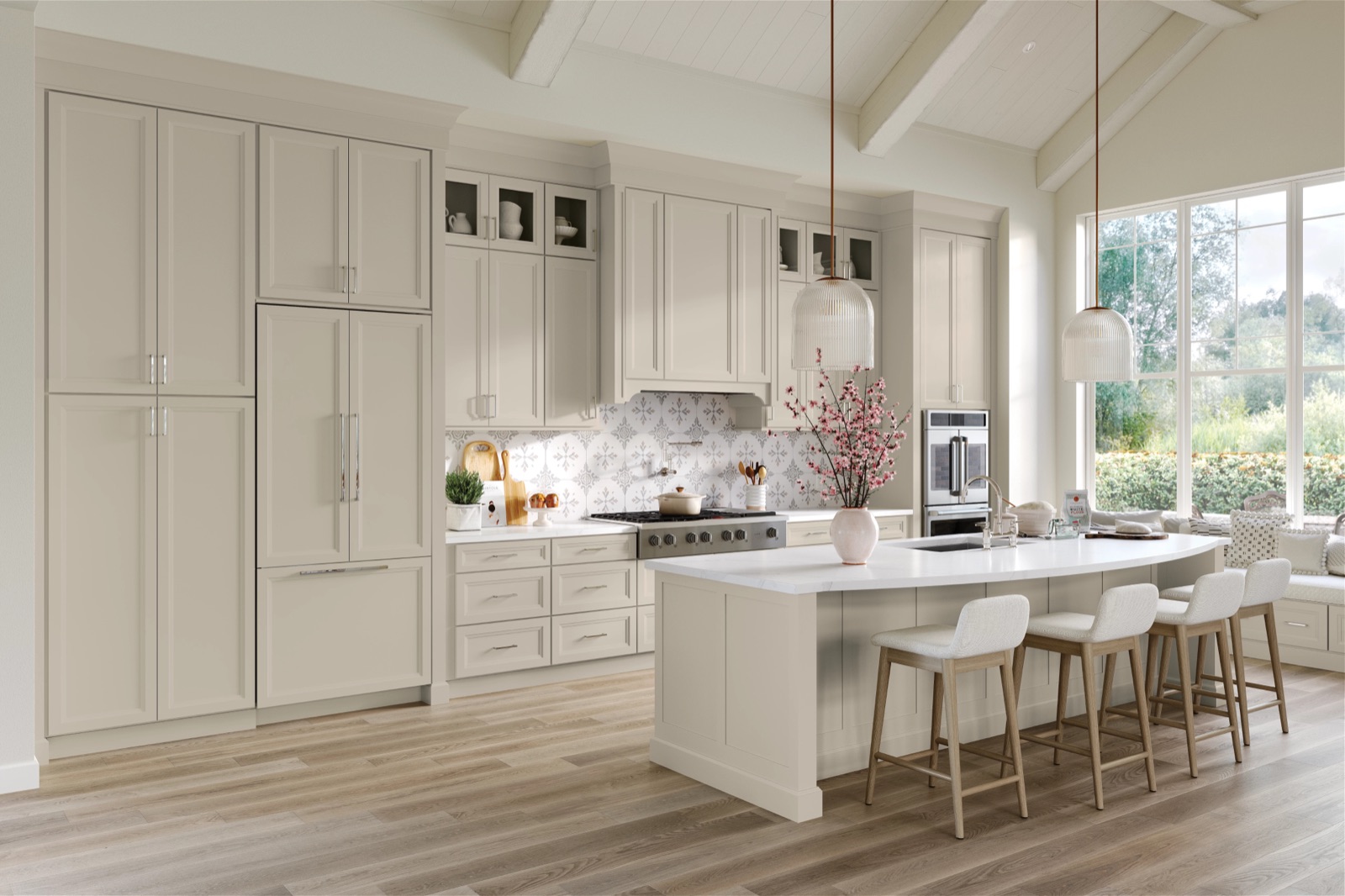 Bright white maple kitchen with a vaulted ceiling and large windows