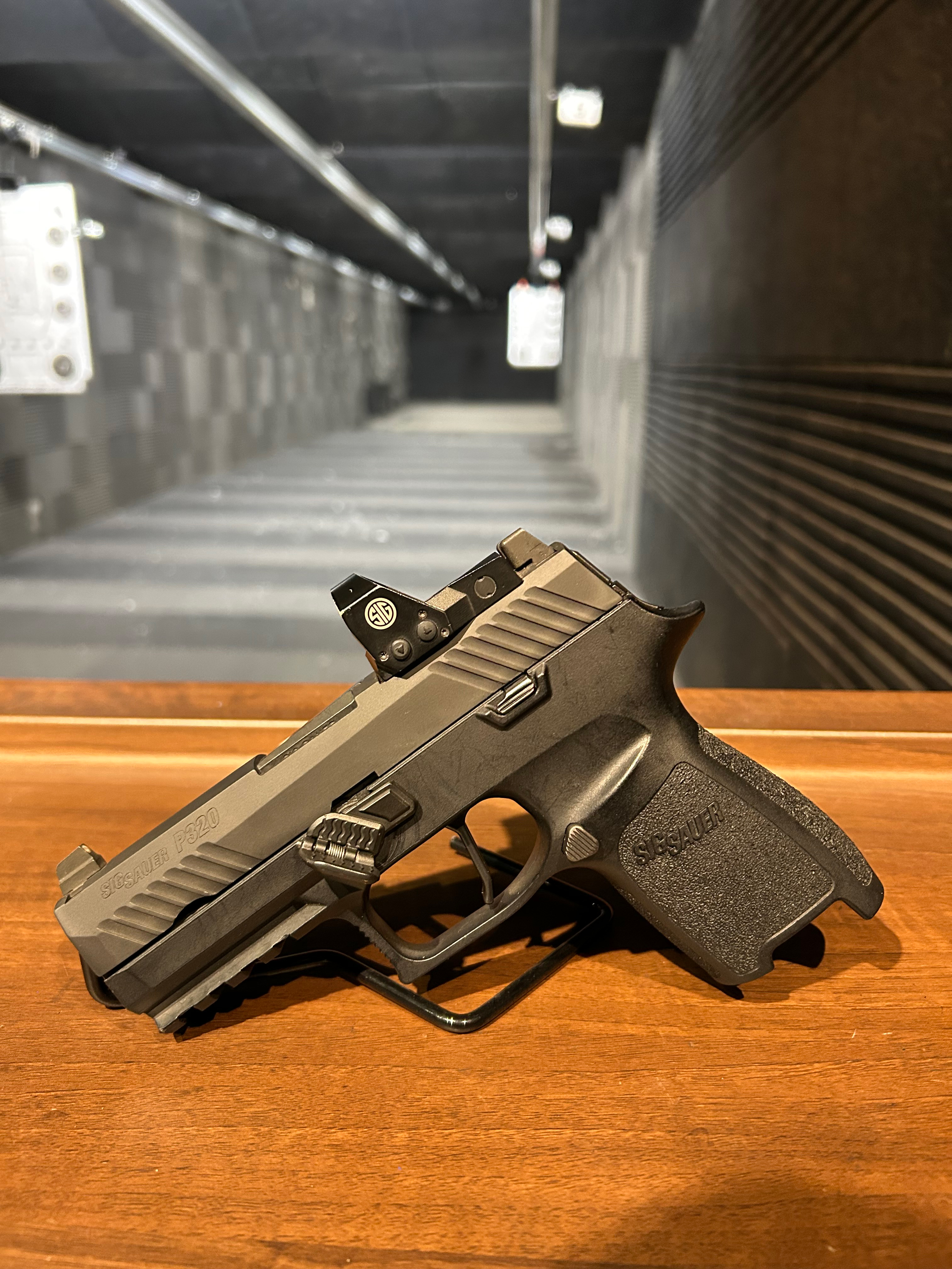 Side view of Black Steel folding thumb rest for sig p320