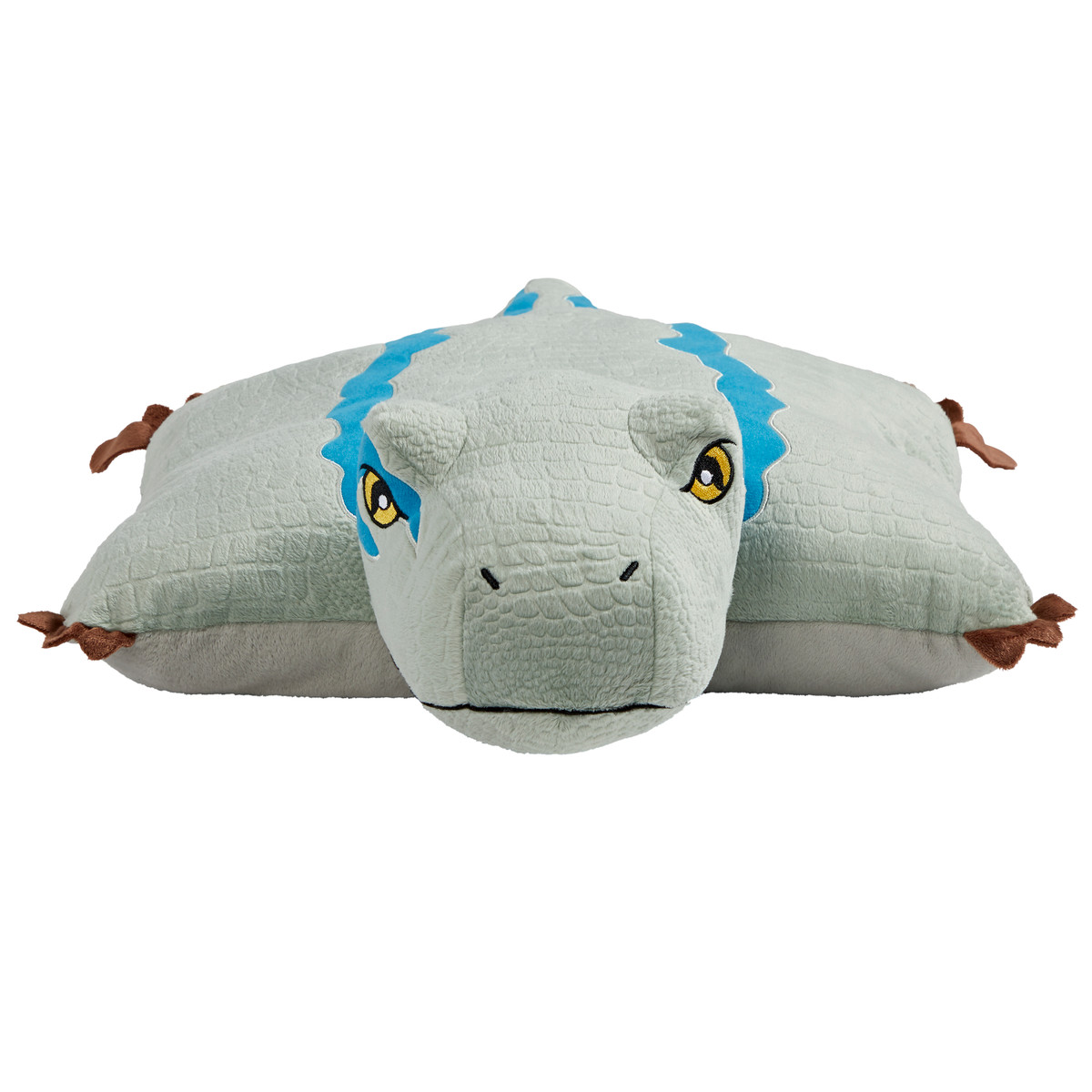 Jurassic World's Velociraptor Blue Pillow Pet unfolded into a soft plush pillow with Blue's head at one end and a blue-gray body extending across the pillow.