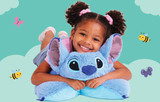 Little girl hugging the Stitch Pillow Pet