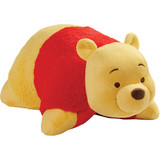 Winnie the Pooh Pillow Pet in plush character form, featuring soft yellow plush, small rounded ears, embroidered eyes, a brown nose, and his signature red shirt.