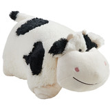 Cozy Cow Pillow Pet in plush character form, featuring soft white plush, black spots, small cream horns, floppy ears, and a sweet embroidered smile.