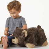 Lifestyle image of little boy playing with the Mr. Bear Pillow Pet.