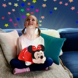Little girl holding the Minnie Mouse Sleeptime Lite smiling and looking up at the colorful stars projected onto the ceiling.