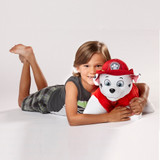 Little boy smiling while hugging the Marshall Pillow Pet.