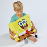 Little boy hugging the SpongeBob SquarePants Pillow Pet.