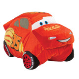 Lightning McQueen Pillow Pet in plush character form, featuring a bright red race car design, racing decals, expressive blue eyes, and a smiling grille.
