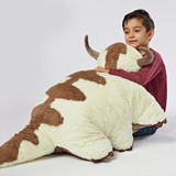 Little boy hugging the Appa jumbo Pillow Pet featuring Appa's fluffy white fur, brown markings, and long brown tail.