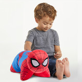 Little boy sitting beside Spider-Man Pillow Pet Lifestyle Image
