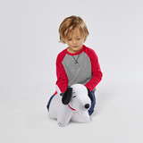 Little boy playing with the Snoopy Pillow Pet.