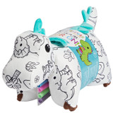 Color On Dinosaur Pillow Pet displayed in packaging with included washable fabric markers.