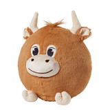 Side view of the Shaggy Cow Puff showing its round plush shape, soft caramel-brown plush, cream-colored horns, small ears, and fluffy tuft of hair.