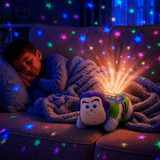 Buzz Lightyear Sleeptime Lite  lifestyle image with little boy sleeping in bed and lots of rainbow stars