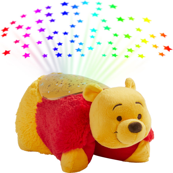 Winnie the Pooh Sleeptime Lite in plush character form projecting colorful stars onto the ceiling, featuring Pooh's golden-yellow fur, red shirt, embroidered eyes, and cheerful smile.