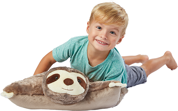 A young boy lying on the brown Sunny Sloth Pillow Pet