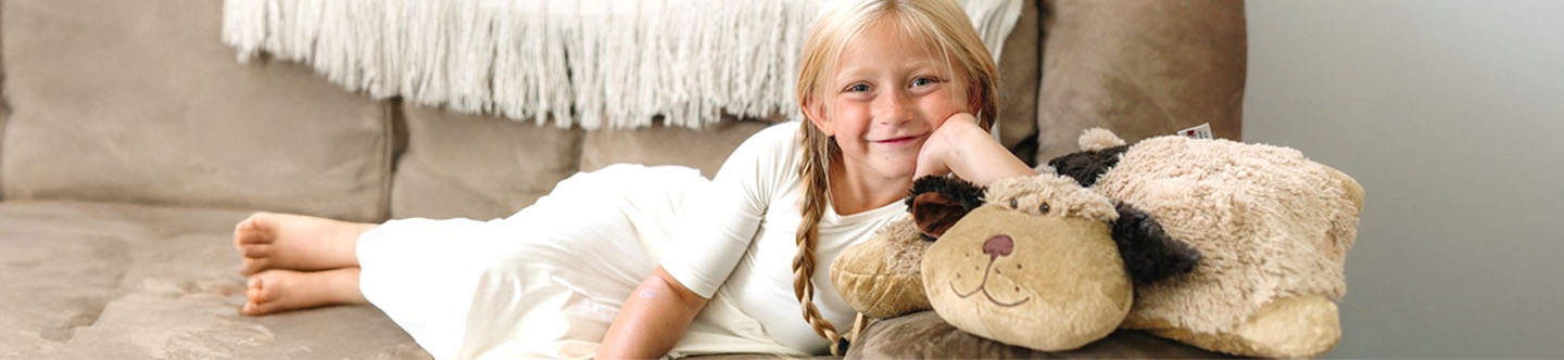 The title is Our Story, and there is an image of a little girl snuggling with a Snuggly puppy Pillow pet.