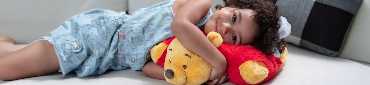 Title is Press and Marketing, and there is an image of a little girl snuggling with a Winnie the Pooh Pillow Pet.
