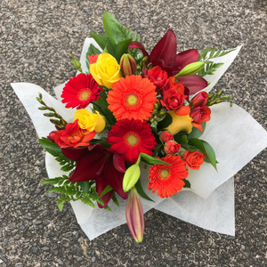 Bright vibrant flowers in a hand tied bouquet