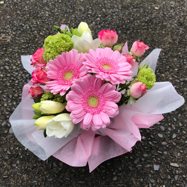 Pinks and white in a carry bag, perfect for any occasion.