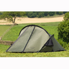 Snugpak Scorpion 2 IX olive tent pitched on grass in open countryside showing full fly-closed exterior profile with opposing pole structure and vent opening visible at rear
