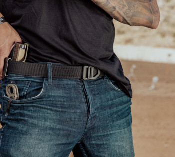 Kore X7 EDC Gun Belt worn with IWB or OWB holster — sturdy 1.5″ width and reinforced structure for daily concealed carry. Kore X7 EDC Gun Belt worn with IWB or OWB holster — sturdy 1.5″ width and reinforced structure for daily concealed carry.