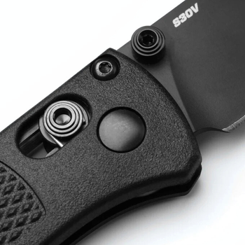 Close-up of Benchmade Mini Bugout AXIS lock and black handle