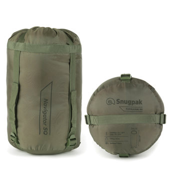 Snugpak Basecamp Ops Navigator olive compression stuff sack standing upright alongside round compressed sack showing Snugpak logo and printed specs label with comfort rating and IsoFibre fill details
