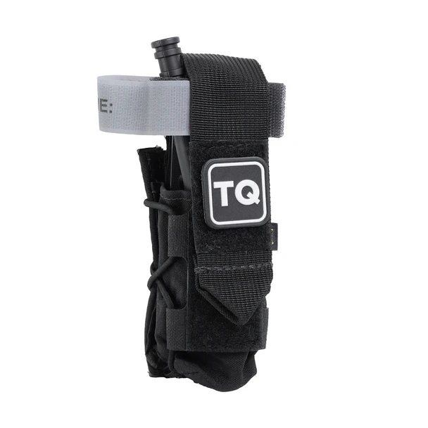 Black High Speed Gear TACO tourniquet pouch with a C-A-T tourniquet stowed inside, front view with TQ label