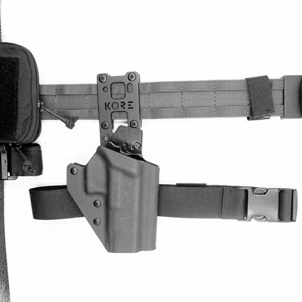 KORE Accessories Holster Mount installed on 1.75″ battle belt, showing robust bracket and leg strap channel for secure thigh carry.
