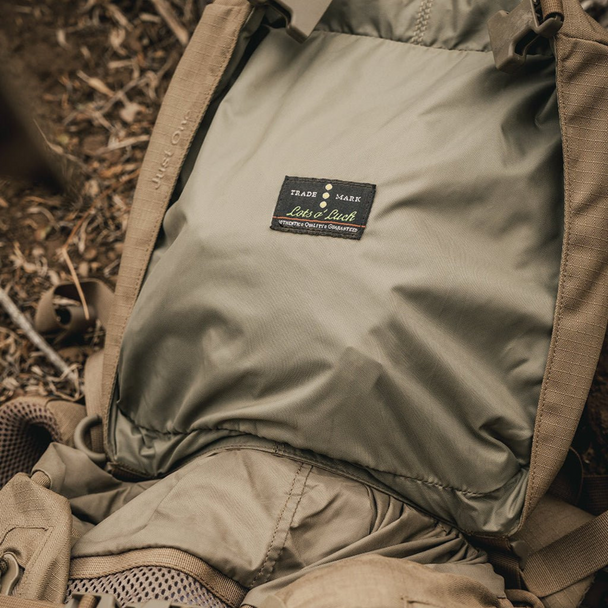 Close-up of the Just One Pack's front zipper access and drawstring top loading system.