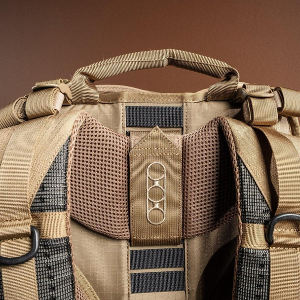 Rear view showing padded shoulder straps, sternum strap, and ventilated back panel.