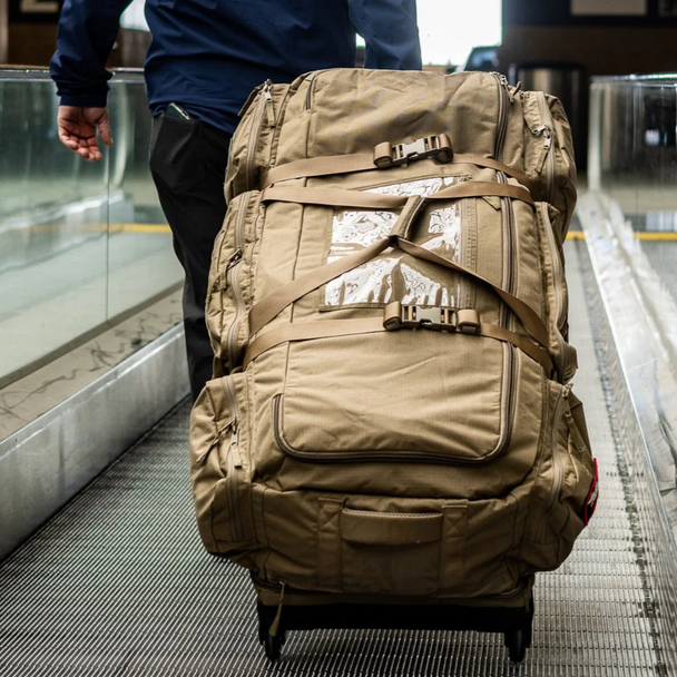 Duffel packed and wheeled along runway, showcasing large capacity and rugged build.