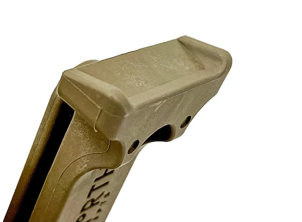 Close-up of The Racker edge designed for one-handed pistol slide manipulation