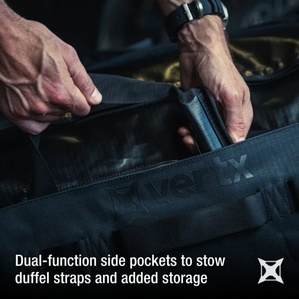 Vertx RLT 50L Duffel Bag VTX-VTX5096 Ranger Green hands accessing dual-function side pocket with duffel straps stowed
