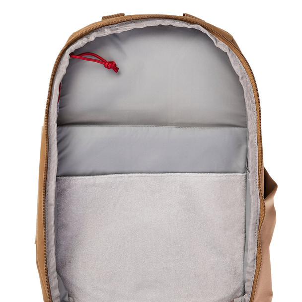 Vertx Siege 15L Sling Pack VTX5306 coyote brown interior close-up showing gray-lined tablet sleeve pocket with red zipper pull at top of main compartment