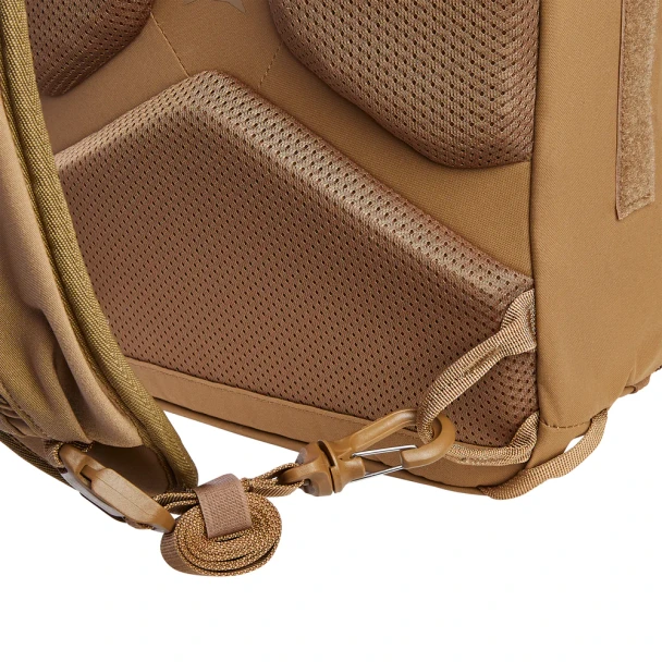 Vertx Siege 15L Sling Pack VTX5306 coyote brown bottom corner close-up showing padded mesh back panel, reinforced base, and drain grommet detail