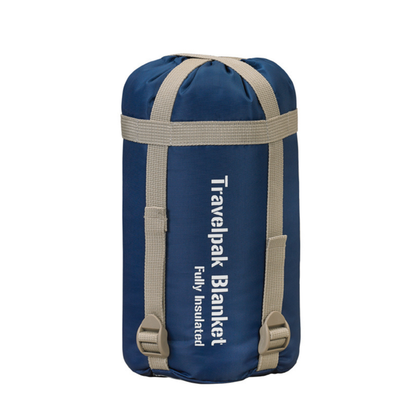 Snugpak Travelpak Blanket navy blue folded flat showing Snugpak logo printed on outer shell and care label tag visible at folded edge
