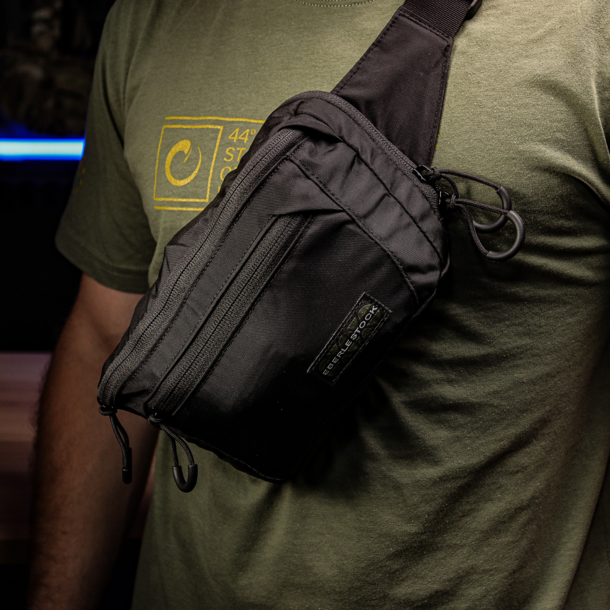 Bando Bag worn cross-body with holster mount visible