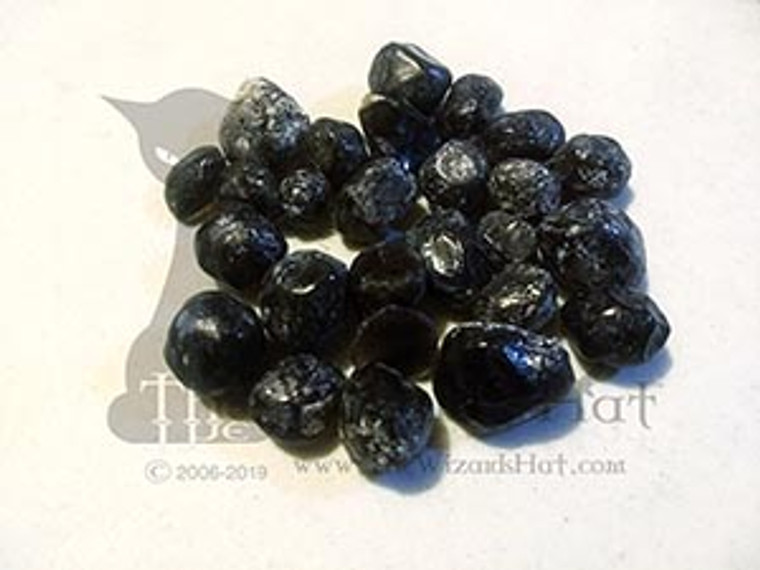1 natural tumbled Apache Tears 1 natural tumbled Apache Tears