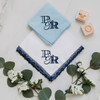 Navy lace handkerchief and powder blue handkerchief, both embroidered with a custom designed monogram in navy thread.