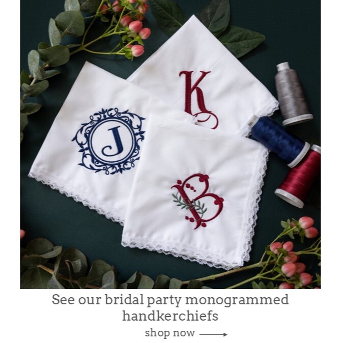 Women's monogrammed handkerchiefs in a variety of thread colors and monogram styles. Shown on white background with flowers.