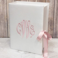 Custom baby keepsake box personalized with a monogram or name. Shown in white with pink embroidery thread.