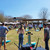 Group of people playing cornhole at an outdoor event, featuring custom cornhole boards. Perfect for weddings, parties, and corporate gatherings