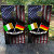 Custom wedding cornhole boards with an American flag background and crossed Irish and German flags, personalized with a family name, perfect for heritage-themed weddings.