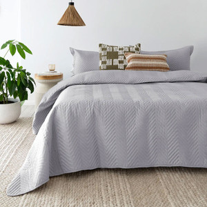 Herringbone Embossed Coverlet Set in Silver styled on the bed Herringbone Embossed Coverlet Set in Silver styled on the bed