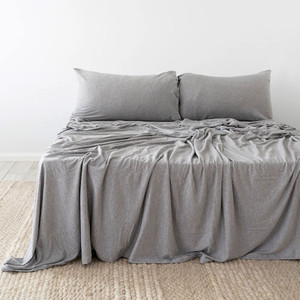 Grey Bambury BedT Organica sheets styled on a made bed, highlighting the smooth knitted finish and breathable drape across pillows and mattress. Grey Bambury BedT Organica sheets styled on a made bed, highlighting the smooth knitted finish and breathable drape across pillows and mattress.